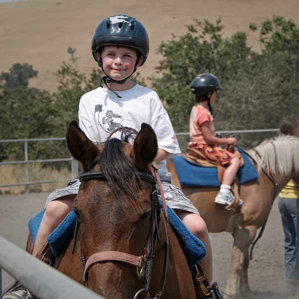 Kids horseback riding at Dorris-Eaton School Day Camp in San Ramon, CA